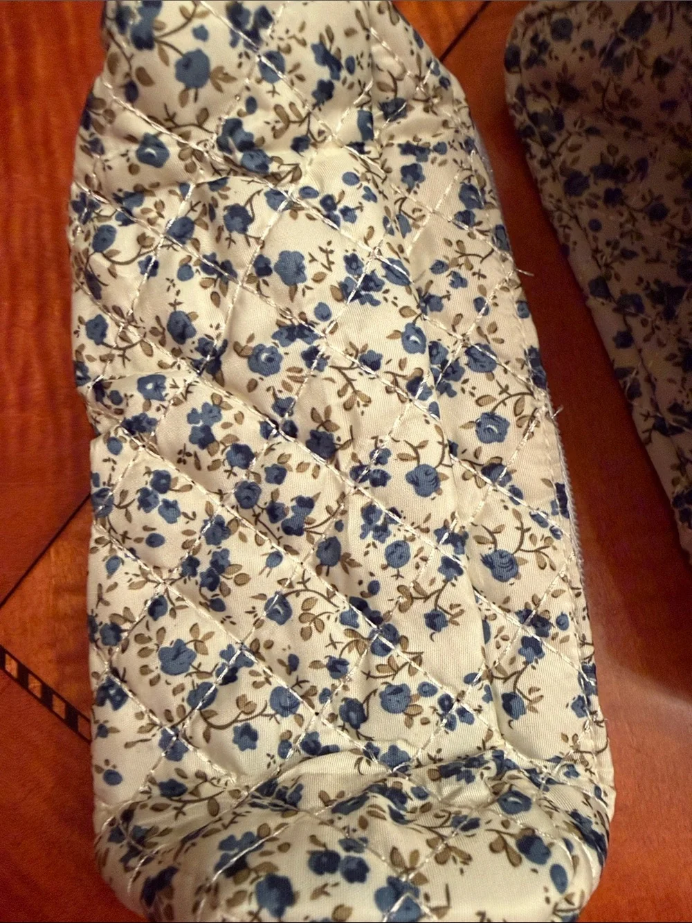 New moon nude Slim Quilted Floral Zip Pouch in Cream and Blue